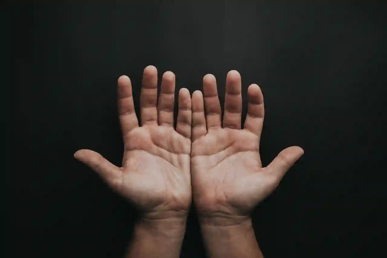 Two hands preparing for palm reading