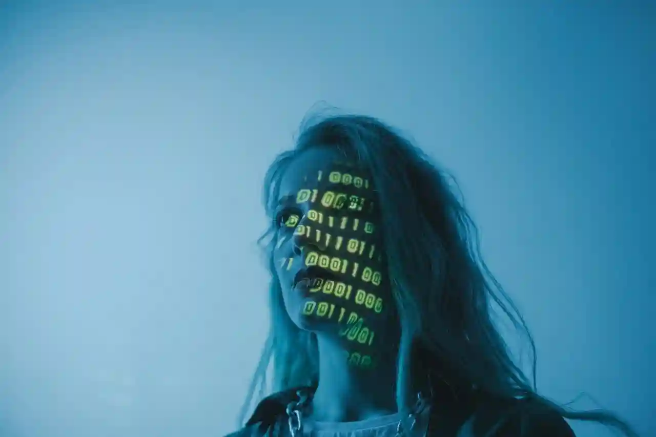 Woman in blue light with green binary code projected across her face